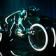 Image for article titled Tron Light Cycle Revealed Live At Flynn's Arcade!